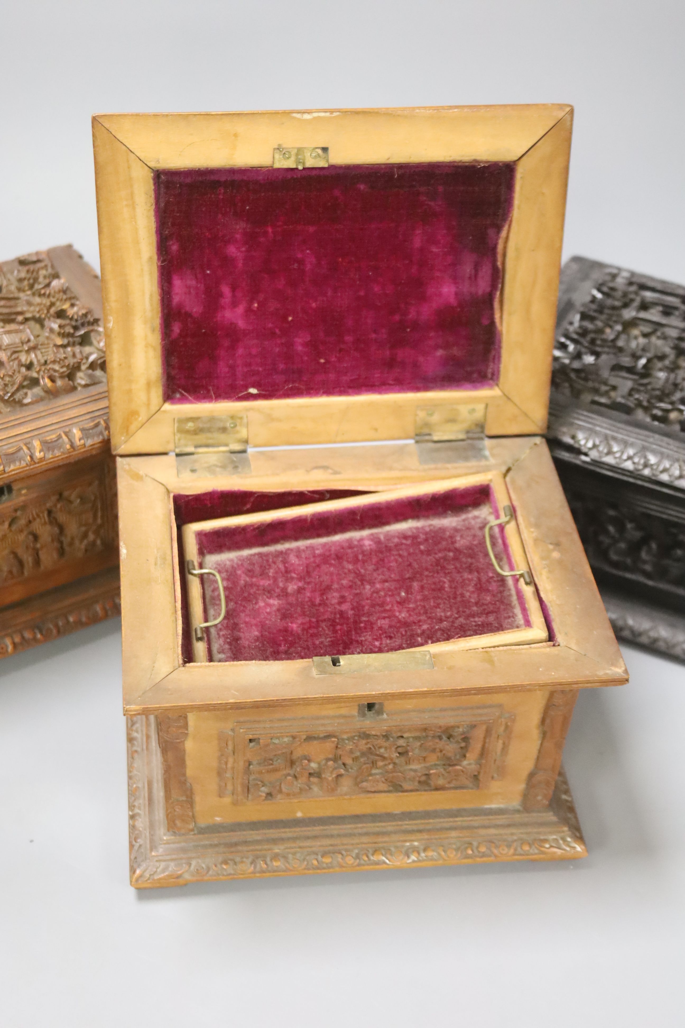 Three Chinese carved wood caskets, largest 17 x 13cm 12cm high